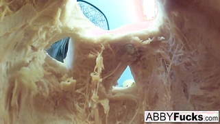After carving a pumpkin, Abigail plays with herself.