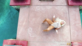 Bridgette B demonstrates her hot body and big juggs outdoors