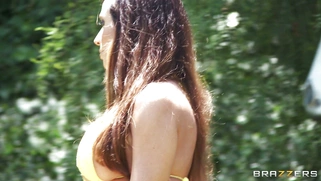 Ariella Ferrera sunbathing by the pool