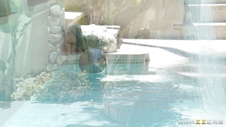 Ariella Ferrera sunbathing by the pool