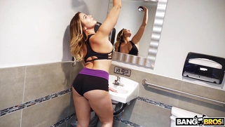 Blair Williams walks into the suntan spot and makes selfies