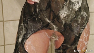 Holly Halston soaping up her huge boobs in the shower