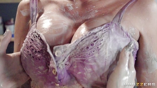 Destiny Dixon and Summer Brielle rubbing wet clay into each other's bodies