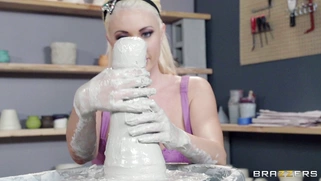 Destiny Dixon and Summer Brielle rubbing wet clay into each other's bodies