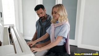 Kenzie Kai takes piano lessons from Charles Dera