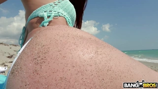 Redhead Aidra Fox has fun on the beach