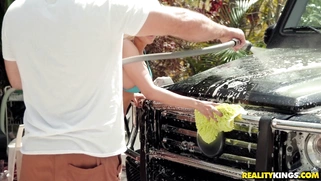 Luna Star and Sophia Leone watching as JMac hoses down the car