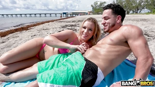 Bailey Brooke orally pleasures Peter Green on the beach