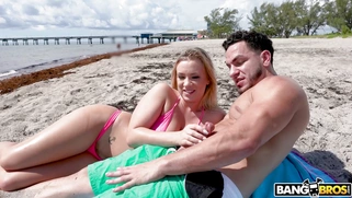 Bailey Brooke orally pleasures Peter Green on the beach