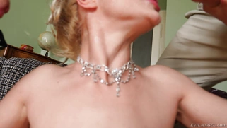 Blonde Cherry Kiss is sucking two big cocks