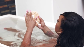 Busty Layton Benton takes the bathtub and plays with her pussy